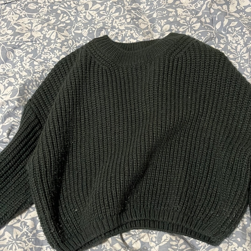 green knitted top